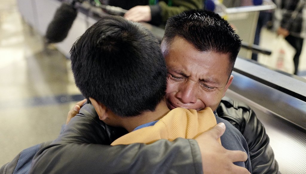 David Xol-Cholom of Guatemala hugs his son, Byron, at Los Angeles International Airport as they reunite Jan. 20, 2020, after being separated during the Trump administration's wide-scale separation of immigrant families. (AP)