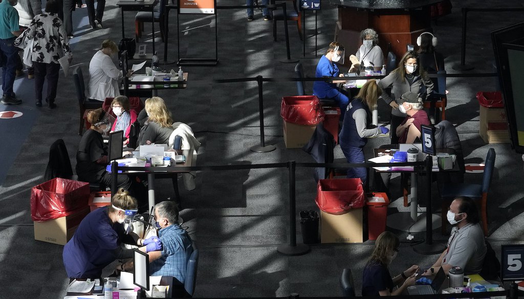 People are administered COVID-19 vaccine on Feb. 11, 2021, at a vaccination center, at Gillette Stadium, in Foxborough, Mass. (AP)
