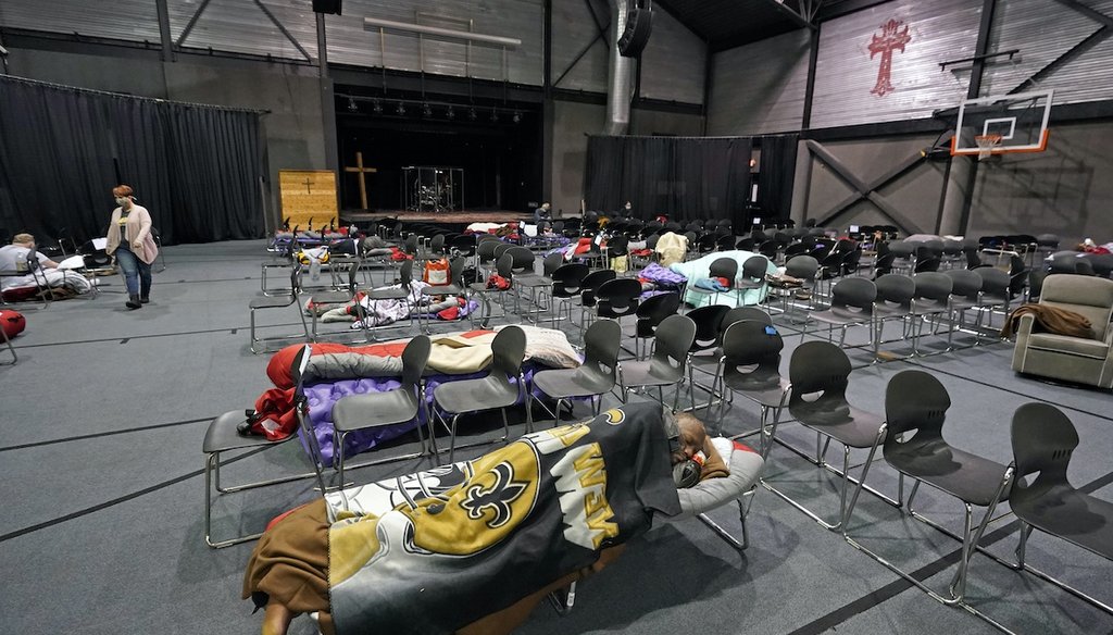 People seeking shelter from below freezing temperatures rest inside a church warming center Feb. 16, 2021, in Houston. (AP)