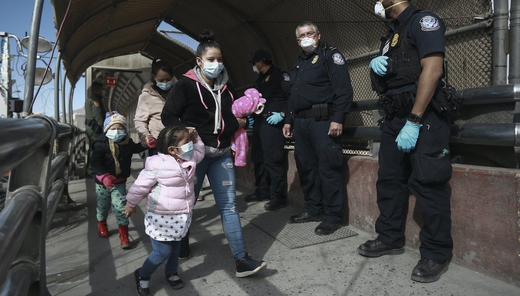 A migrant family crosses the border into El Paso, Texas, in Ciudad Juarez, Mexico, on Feb. 26, 2021. (AP)