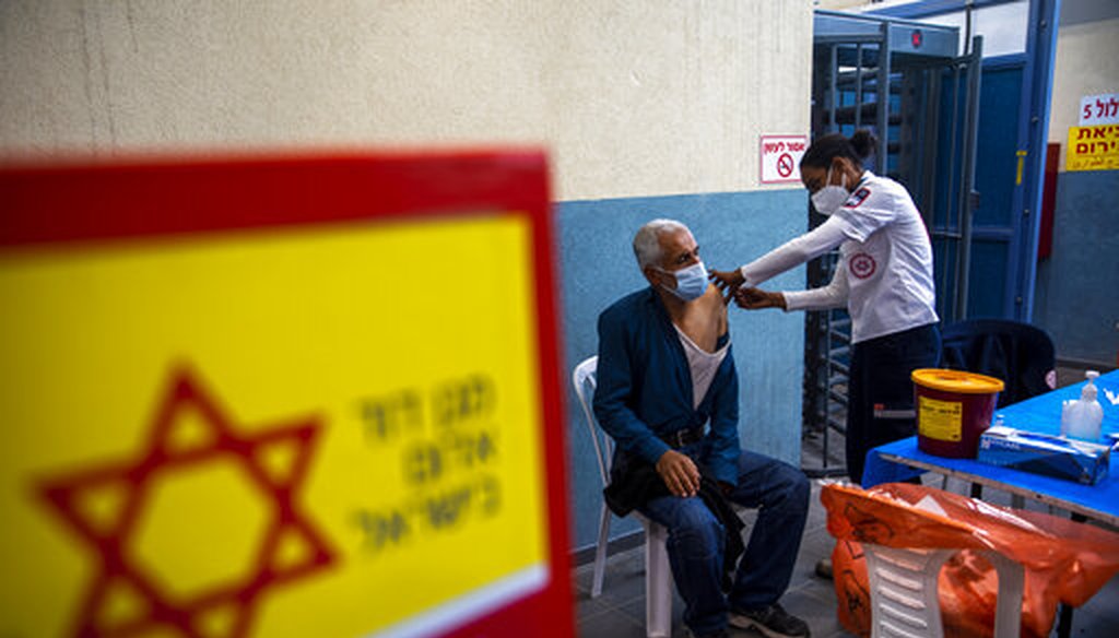 A Palestinian laborer who works in Israel receives his first dose of the Moderna COVID-19 vaccine at a vaccination center at the Meitar checkpoint between Israel and the West Bank on March 8, 2021. (AP)