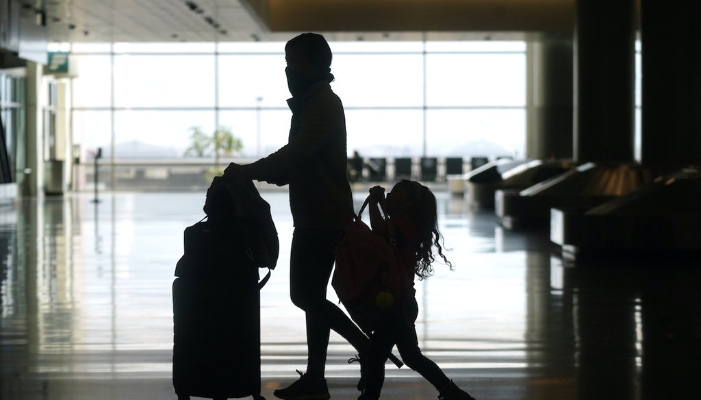 Travelers walk through the Salt Lake City International Airport on March 17, 2021, in Salt Lake City. (AP)