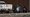 A U.S. Customs and Border Protection vehicle is seen next to migrants after they were detained and taken into custody, March 21, 2021, in Abram-Perezville, Texas. (AP)