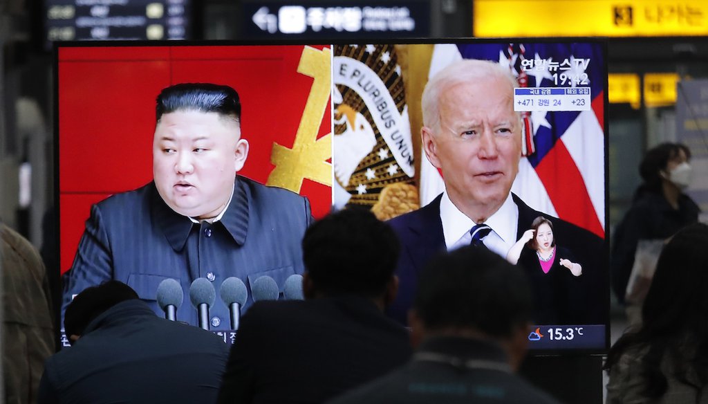 A TV shows images of North Korean leader Kim Jong Un and U.S. President Joe Biden at the Suseo Railway Station in Seoul, South Korea, on March 26, 2021. (AP/Young-joon)
