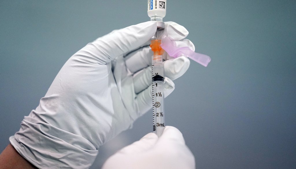 In this March 26, 2021, file photo, a member of the Philadelphia Fire Department prepares a dose of the Johnson & Johnson COVID-19 vaccine at a vaccination site setup at a Salvation Army location in Philadelphia. (AP)