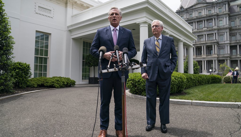 Senate Minority Leader Mitch McConnell of Ky., listens as House Minority Leader Kevin McCarthy of Calif., talks to reporters outside the White House, May 12, 2021. (AP)