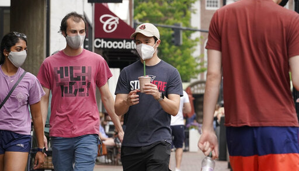 Pedestrians wear masks in Harvard Square in Cambridge, Mass., on May 23, 2021. (AP)
