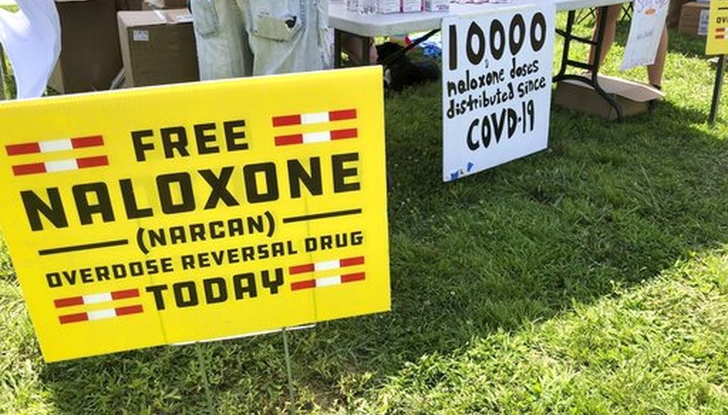 Volunteers pass out free doses of naloxone, a drug that reverses the effects of an opioid overdose, on June 26, 2021, in Charleston, W.Va. (AP)
