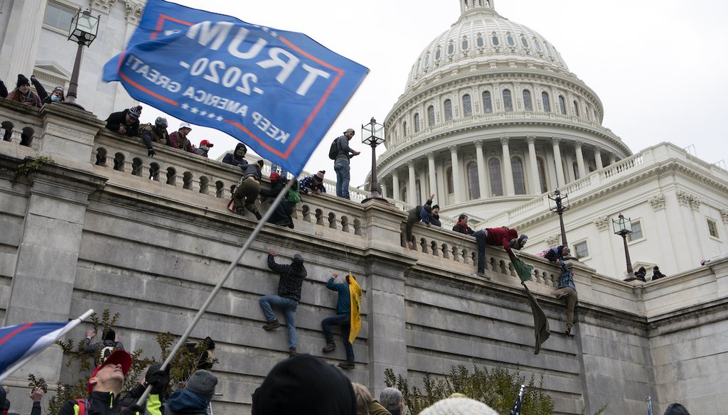 Supporters of President Donald Trump climb the West wall of the the U.S. Capitol on Jan. 6, 2021, in Washington. (AP)