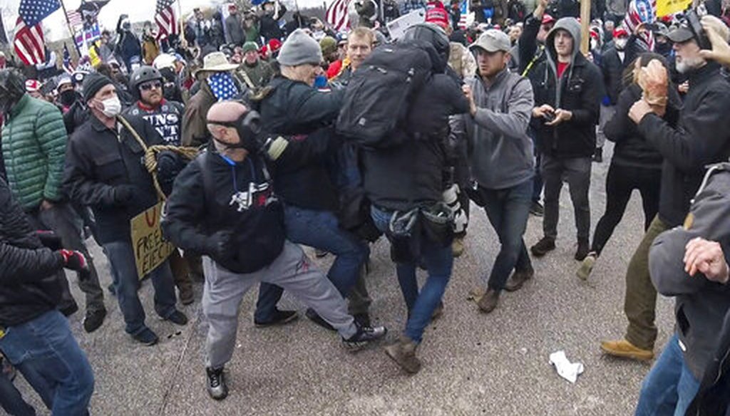 Alan William Byerly, center, in gray skull cap, is seen allegedly attacking an Associated Press photographer during a riot at the U.S. Capitol on Jan. 6, 2021. (AP)