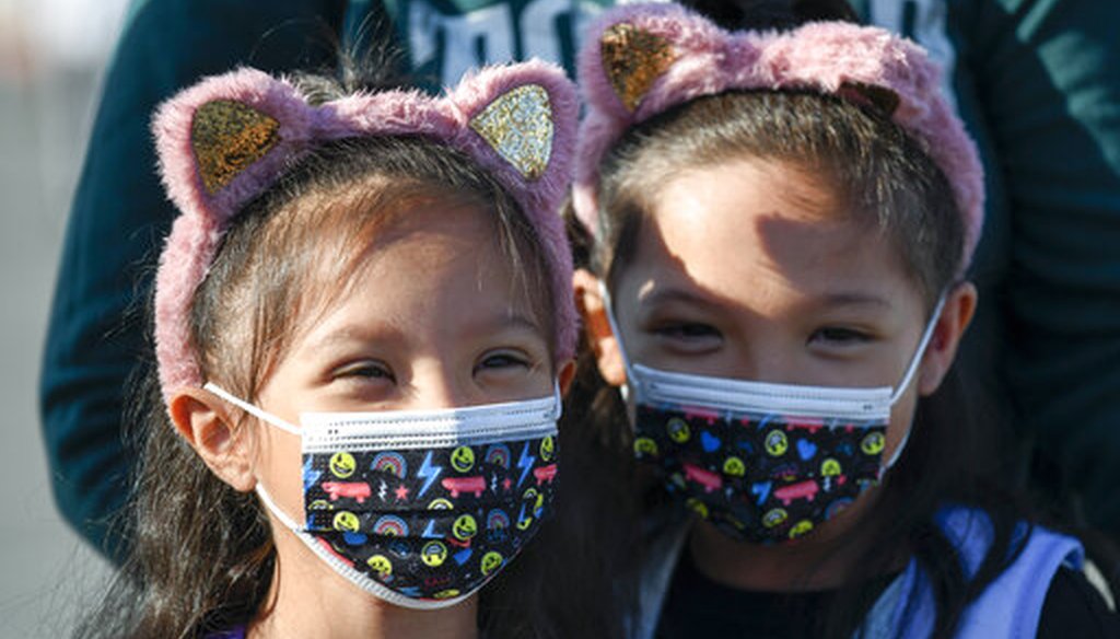 Masked students wait to go their classrooms on the first day of school at Enrique S. Camarena Elementary School Wednesday, July 21, 2021, in Chula Vista, Calif. (AP)
