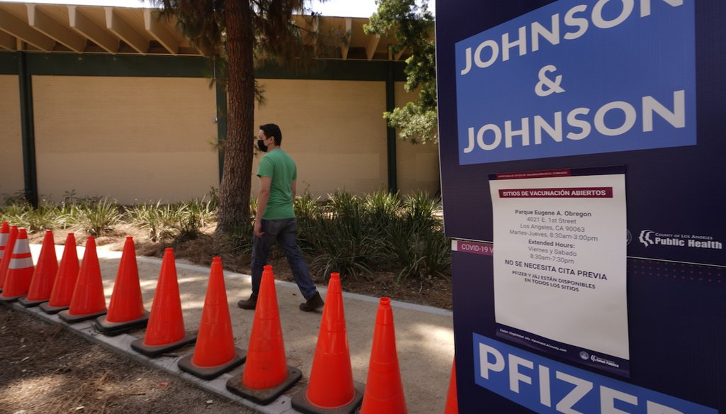 Carlos Arrendondo arrives for his appointment to get vaccinated, as banners advertise the availability of the Johnson & Johnson and Pfizer COVID-19 vaccines at a county-run vaccination site at the Eugene A. Obregon Park in Los Angeles, July 22, 2021. (AP)