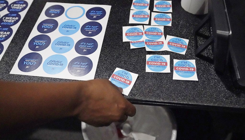 A student selects a sticker after receiving a shot of the COVID-19 vaccine at the Rose E. McCoy Auditorium at Jackson State University in Jackson, Miss., July 27, 2021. (AP)