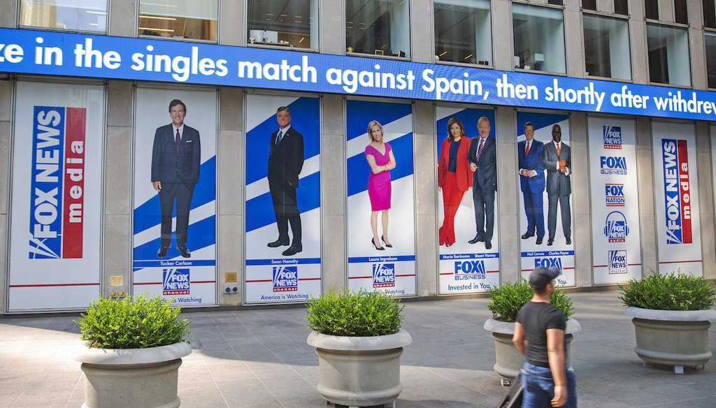 Several Fox News and Fox Business Network hosts are pictured in promotional posters outside Fox News studios at News Corporation headquarters in New York on July 31, 2021. (AP)