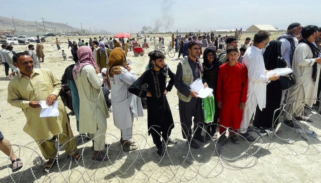 Hundreds of people gather outside the international airport in Kabul, Afghanistan, Aug. 17, 2021. (AP)