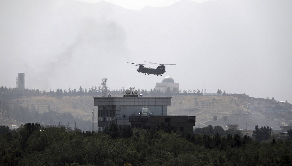 A U.S. Chinook helicopter flies over the U.S. Embassy in Kabul, Afghanistan, on Aug. 15, 2021. (AP/Gul)