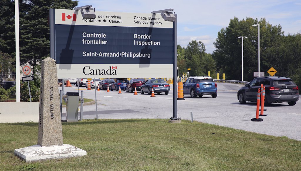 Cars pass a monument marking the border between the United States and Canada on Wednesday, Sept. 1, 2021, at Highgate Springs, Vt. (AP)