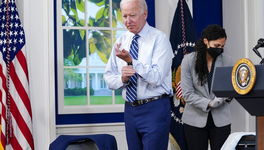 President Joe Biden buttons his sleeve after receiving a COVID-19 booster shot on Sept. 27, 2021. (AP)