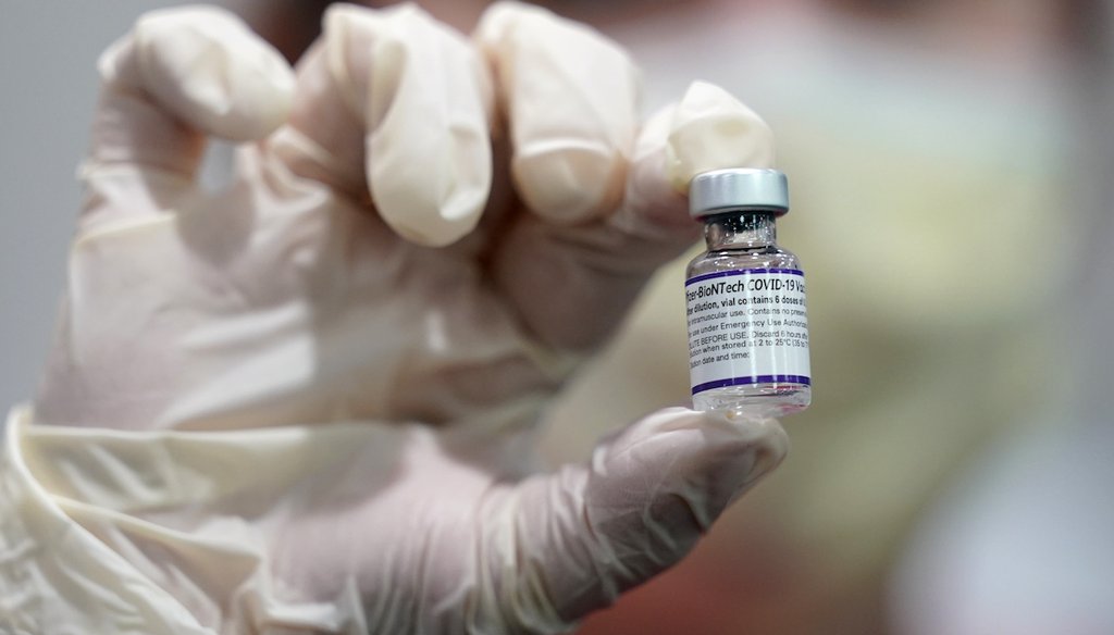 A healthcare worker holds a vial of the Pfizer COVID-19 vaccine at Jackson Memorial Hospital in Miami, Oct. 5, 2021 (AP)