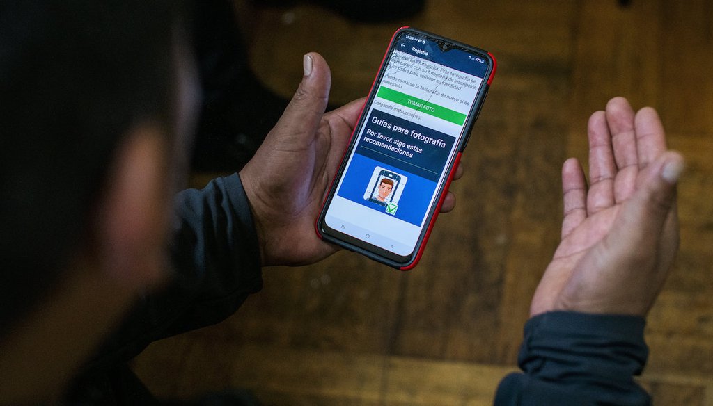 Ecuadorian immigrant Neptali Chiluisa shows the app that he uses for reporting his location to immigration authorities, during an interview Oct. 21, 2021, in New York. (AP)