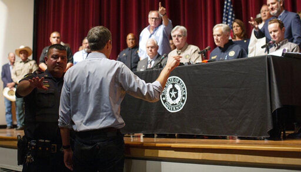 Democrat Beto O'Rourke, who is running against Greg Abbott for governor in 2022, interrupts a news conference headed by Texas Gov. Greg Abbott in Uvalde, Texas May 25, 2022. (AP)