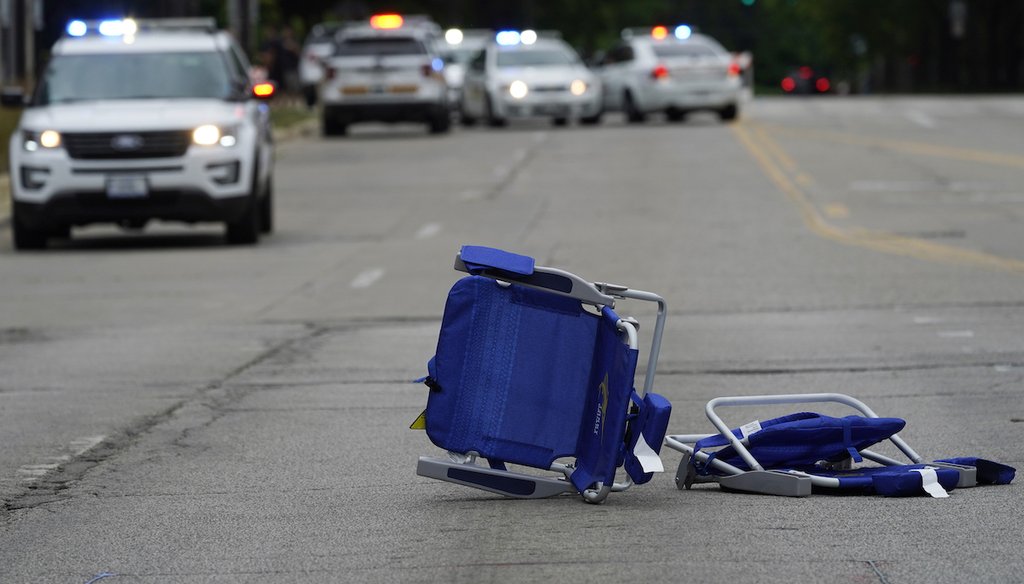 Empty chairs are seen on the street after a mass shooting at the Highland Park Fourth of July parade in downtown Highland Park, Ill., on July 4, 2022. (AP)