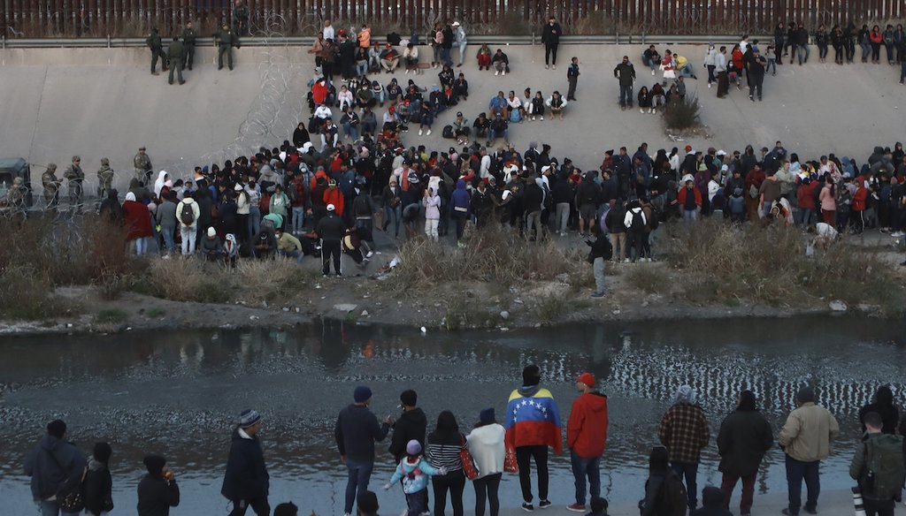 Migrants gather at a crossing into El Paso, Texas, as seen from Ciudad Juárez, Mexico, Dec. 20, 2022. (AP)