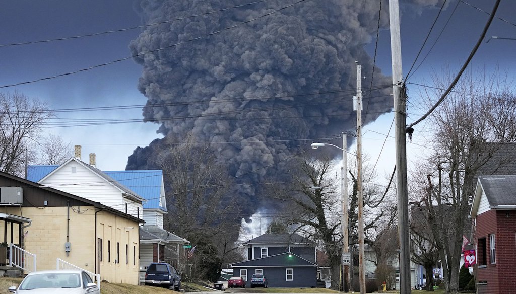 A black plume rises over East Palestine, Ohio, as a result of a controlled detonation of a portion of a derailed Norfolk Southern trains on Feb. 6, 2023. (AP)