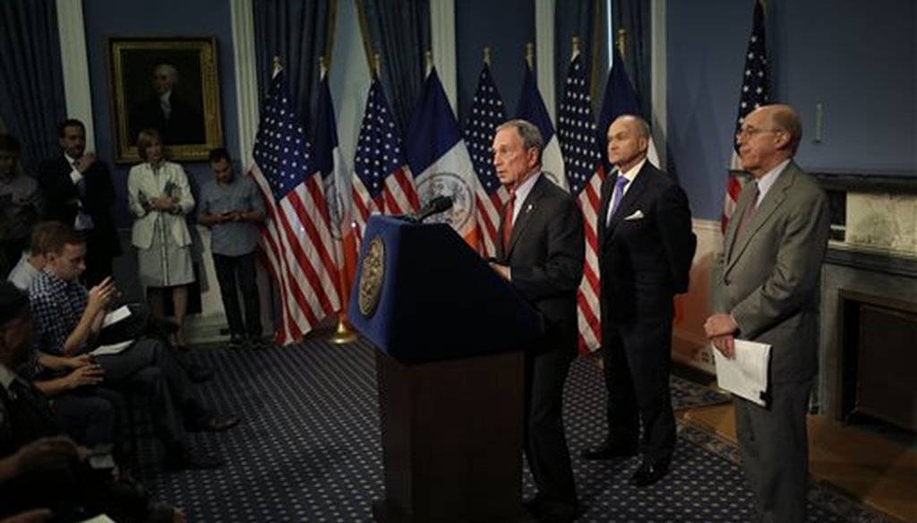 New York City Mayor Michael Bloomberg, left, speaks while Police Commissioner Ray Kelly, center, and attorney Michael Cardozo look on during a news conference in New York, Aug. 12, 2013. (AP/Seth Wenig)