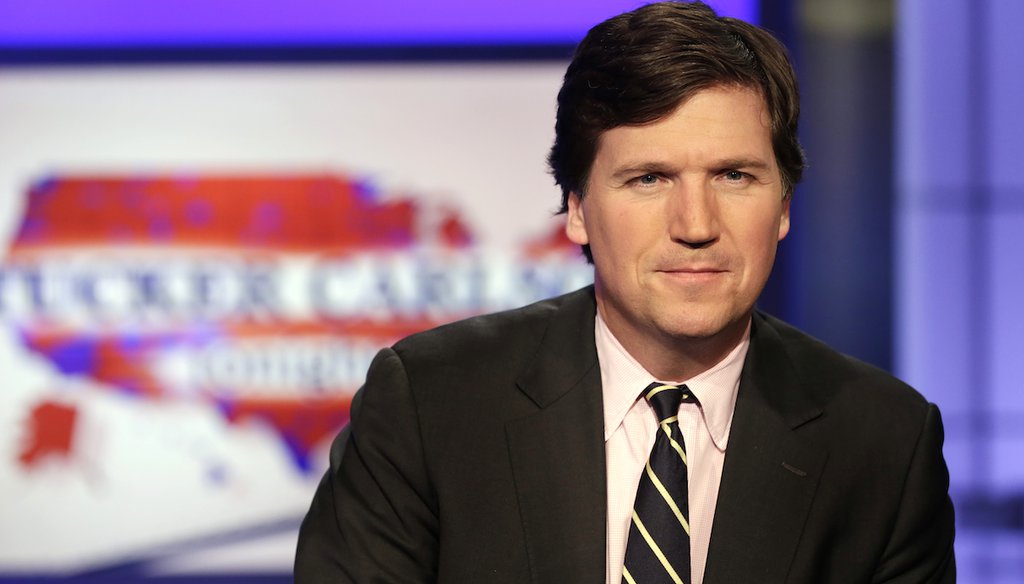 Tucker Carlson, host of "Tucker Carlson Tonight," poses for photos in a Fox News Channel studio, in New York, March 2, 2017. (AP)