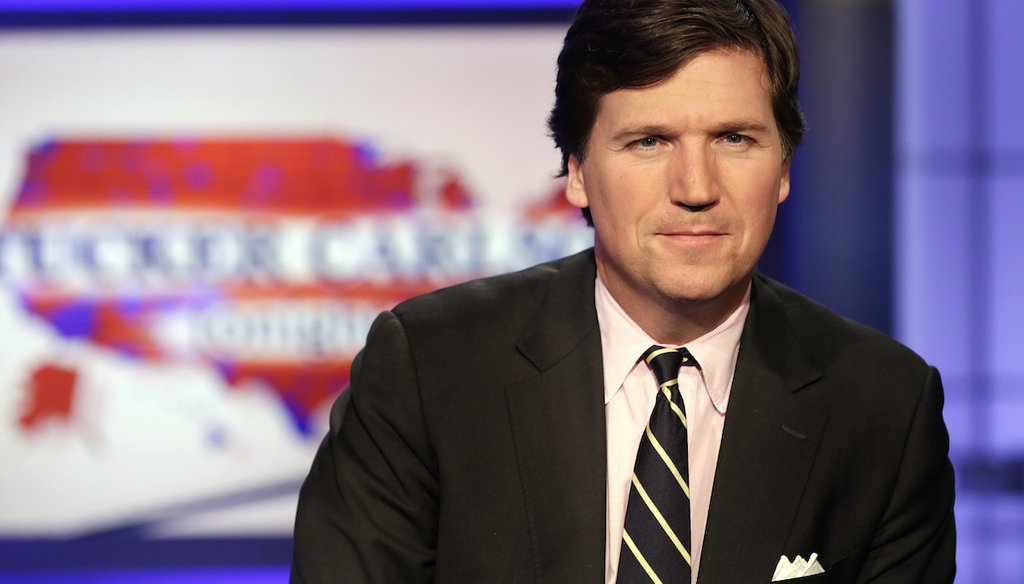 Tucker Carlson poses for photos in a Fox News Channel studio in New York on March 2, 2017. (AP/Drew)