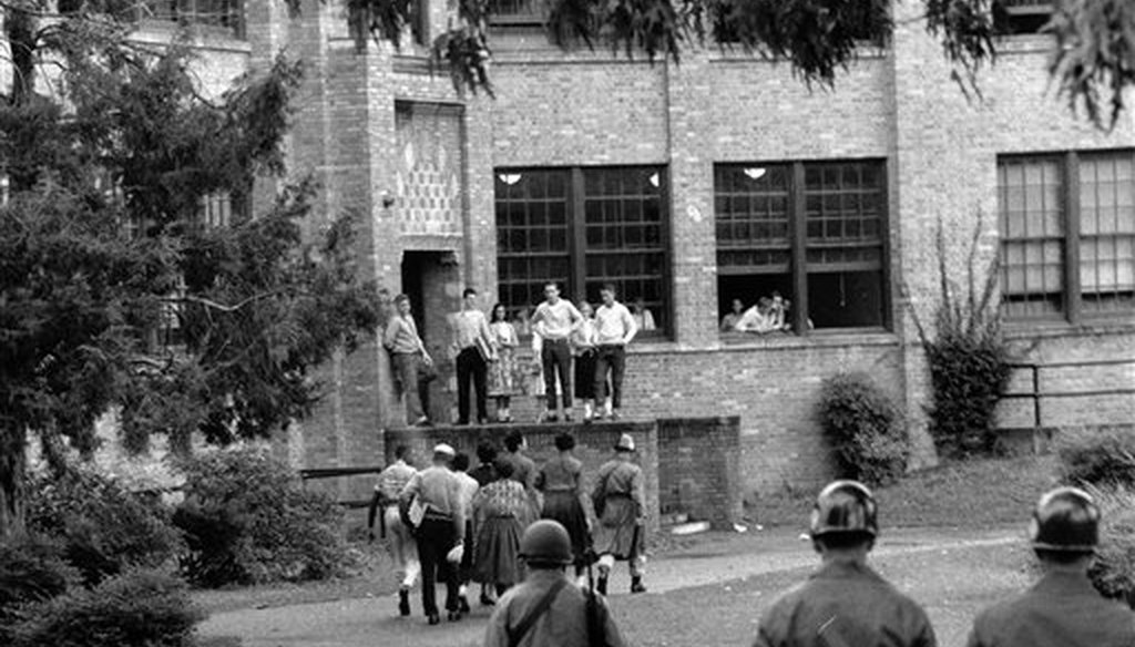 Seven of nine black students walk onto the campus of Central High School in Little Rock, Ark., escorted by federalized National Guard officers on Oct. 15, 1957. (AP)