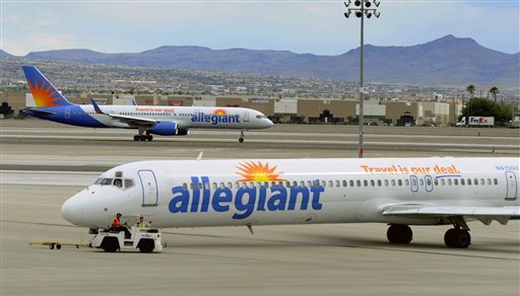 Two Allegiant Air jets taxi at McCarran International Airport in Las Vegas on May 9, 2013.  (AP Photo/David Becker, File)