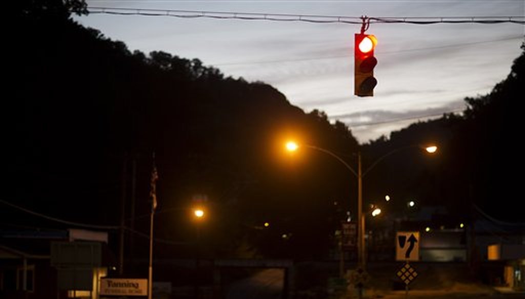 The only traffic light in McDowell County hangs over an intersection in Welch, W.Va., in 2015. (AP)