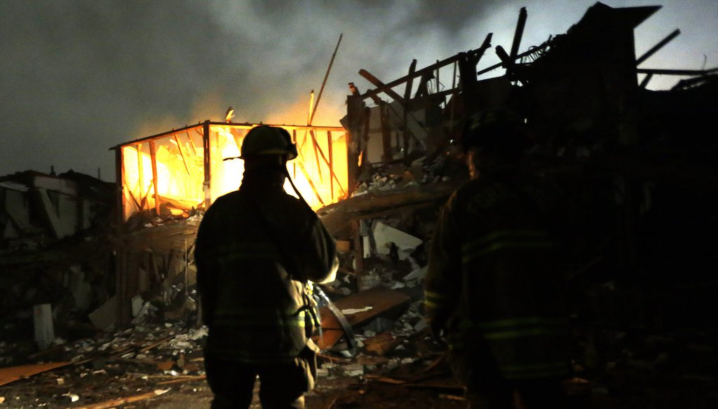 Firefighters use flashlights on April 18, 2013, to search a destroyed apartment complex near a fertilizer plant that exploded in West, Texas. (AP)