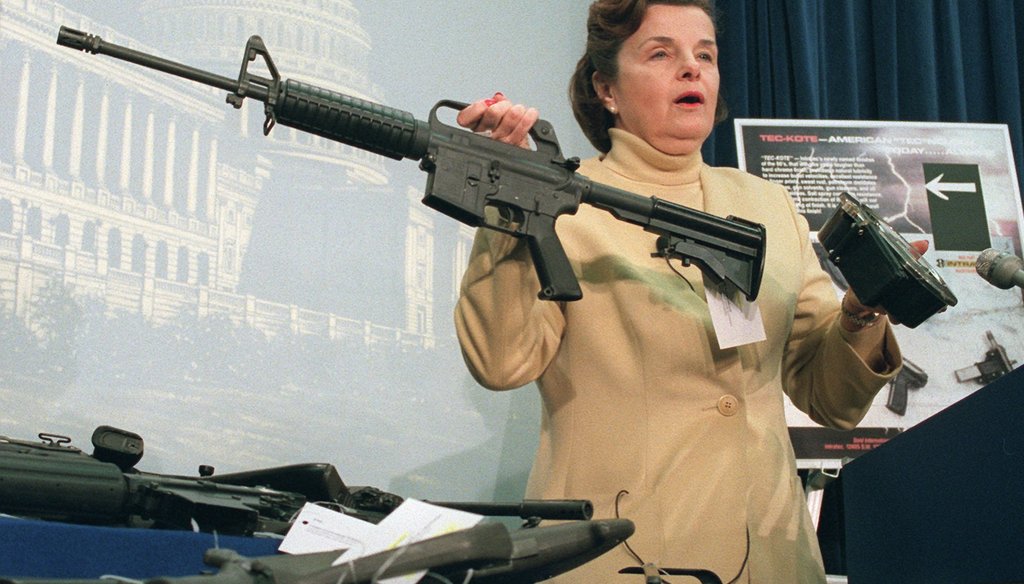 Sen. Dianne Feinstein, D-Calif., holds an AR-15 assault-style rifle with a collapsible stock during a Capitol Hill news conference Friday, March 22, 1996 after the House voted to repeal the two-year-old assault-style firearms ban. 