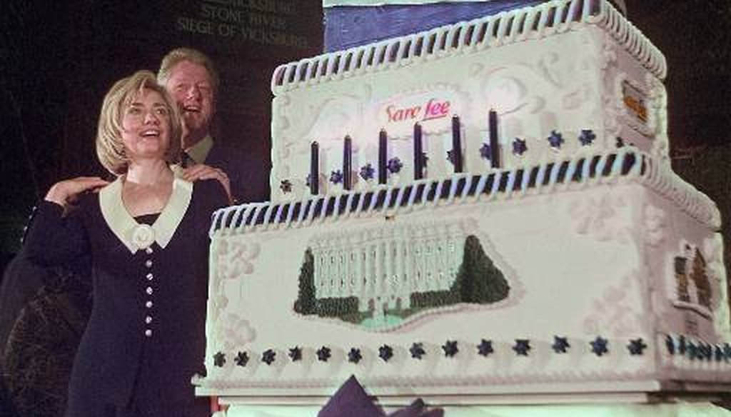 Then-first lady Hillary Rodham Clinton eyes her birthday cake as President Bill Clinton looks on during a celebration of her 50th birthday in October 1997. (AP)
