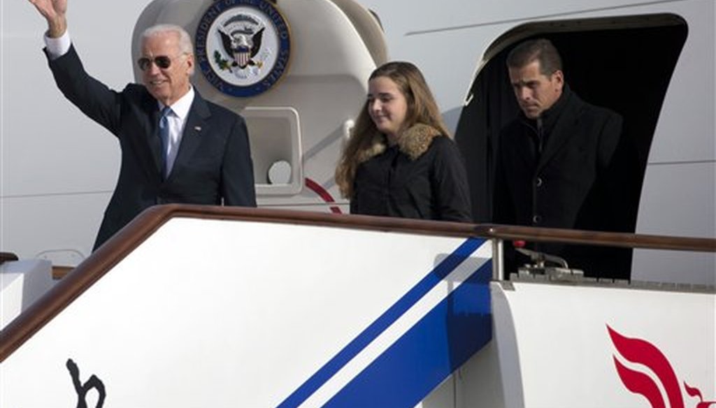 Then-Vice President Joe Biden arrives on Air Force Two in Beijing, China, with his son Hunter Biden and his granddaughter Finnegan Biden on Dec. 4, 2013. (AP)