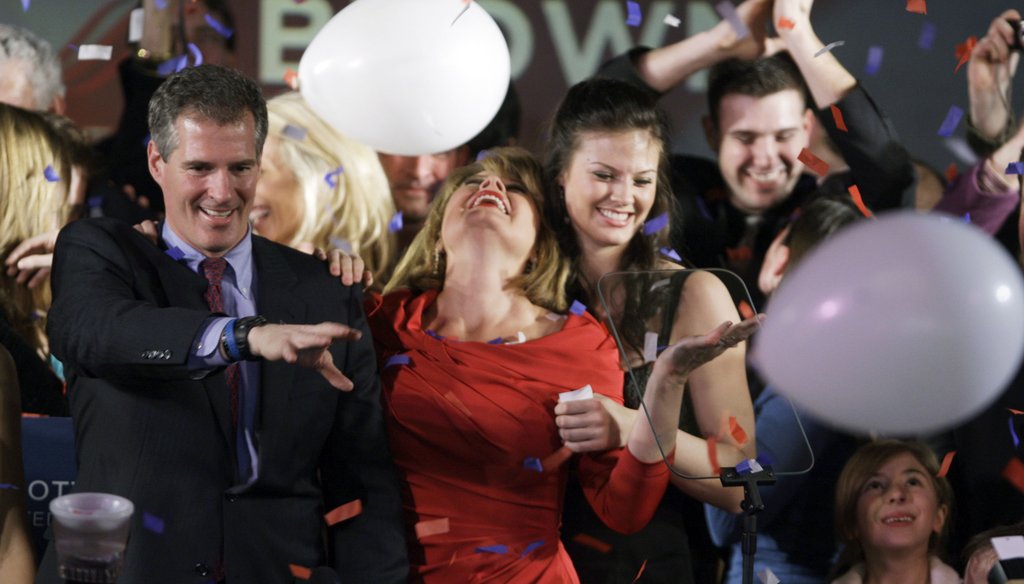 Scott Brown celebrates in Boston, Jan. 19, 2010, with wife Gail, center, and daughter Ayla, and niece Maeve Brown, right, after winning a special election held to fill the U.S. Senate seat of the late Ted Kennedy. (AP)