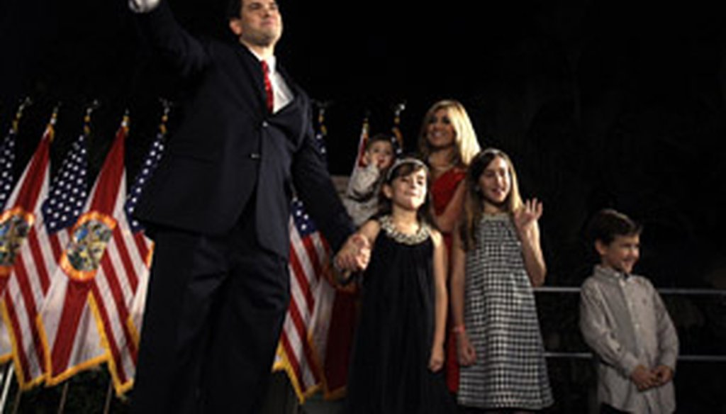 Senator-elect Marco Rubio and his family wave to supporters Tuesday night in Miami.