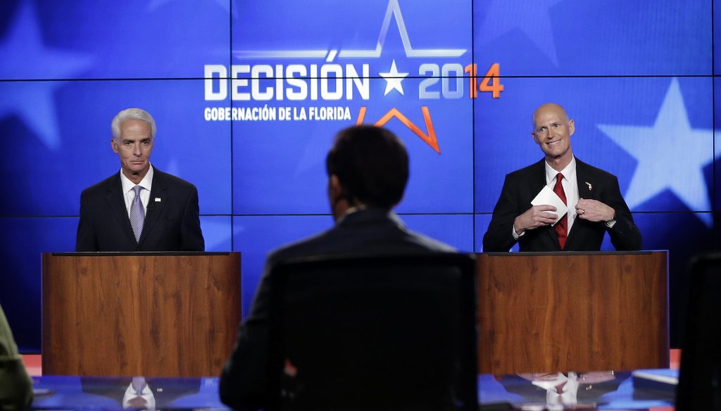 Charlie Crist and Rick Scott appear together in their first debate, on Oct. 10, 2014, at Telemundo studios in Miramar. (AP photo)