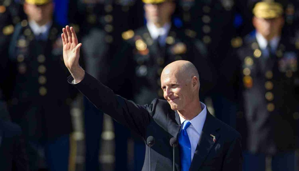 Florida Gov. Rick Scott waves after the swearing in for his second term at the Florida state capitol, Jan. 6, 2015. (AP Photo)