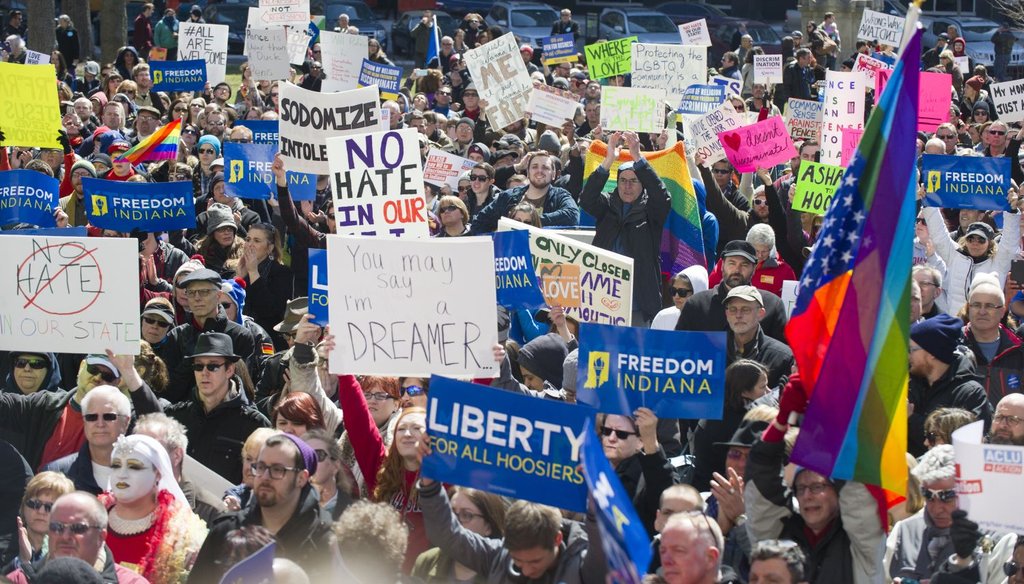 Opponents of Indiana's Religious Freedom Restoration Act gathered on the lawn of the Indiana State House to rally on March 28, 2015. (AP Photo)