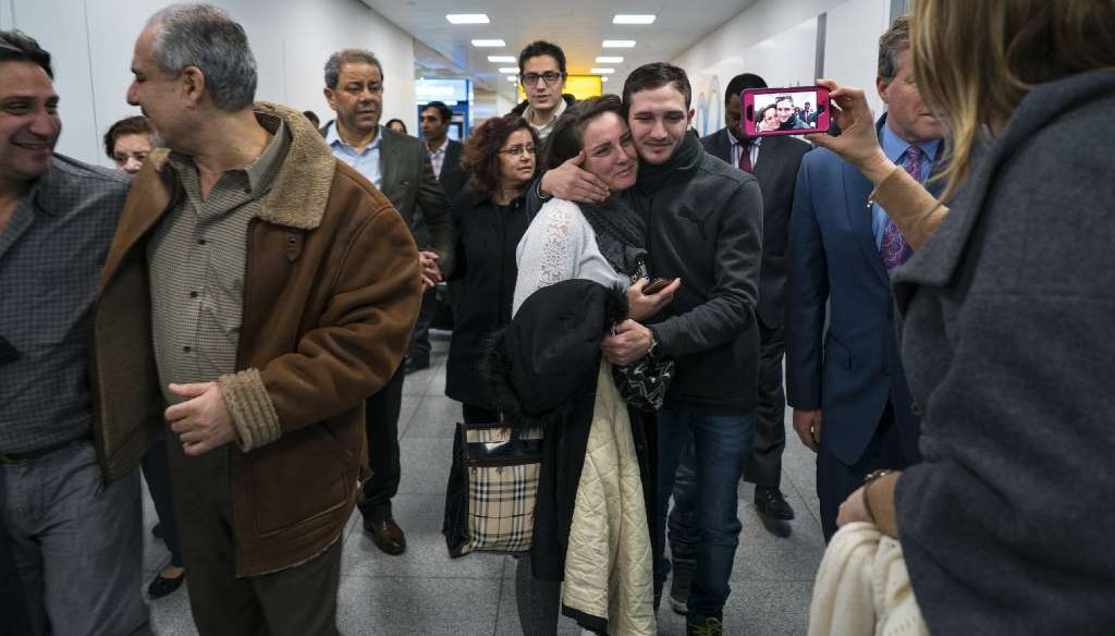 Family members who have just arrived from Syria embrace and are greeted by family who live in the United States upon their arrival at John F. Kennedy International Airport in New York, Monday, Feb. 6, 2017. (AP Photo/Craig Ruttle) 