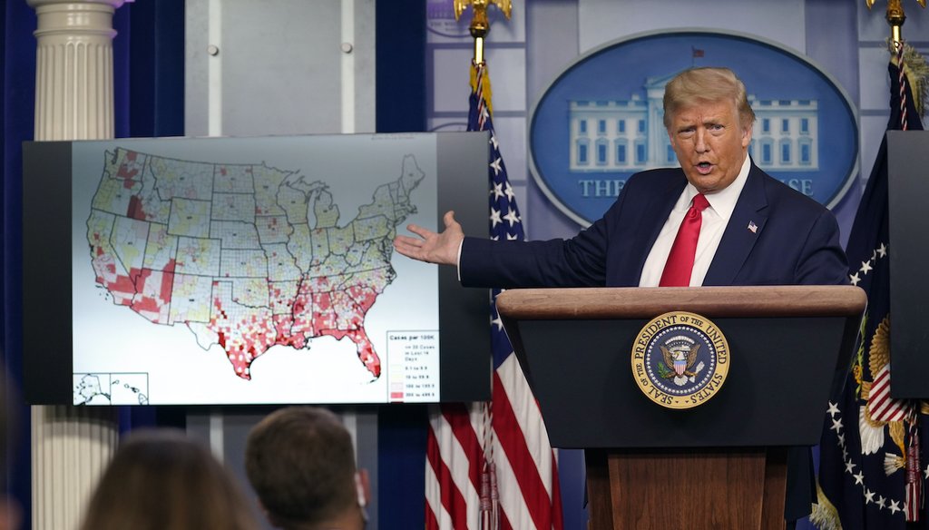 President Donald Trump gestures towards a graphic on the coronavirus outbreak as he speaks during a news conference at the White House on July 23, 2020, in Washington. (AP/Vucci)