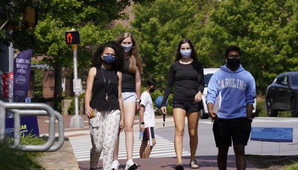 Students wear masks on campus at the University of North Carolina in Chapel Hill, N.C., Tuesday, Aug. 18, 2020. (AP/Gerry Broome)