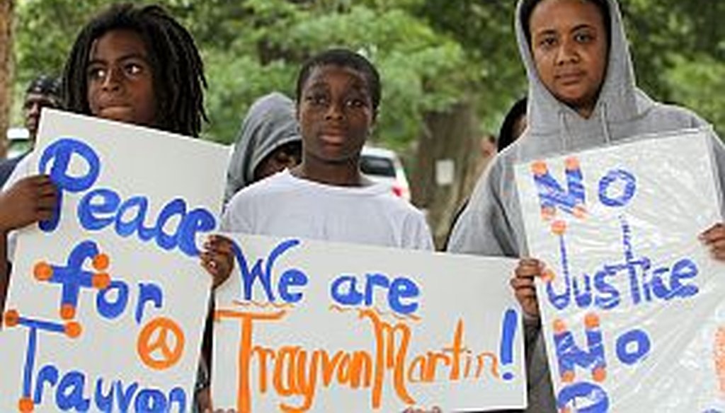 Protestors attend an Atlanta rally and march in opposition to the verdict in the George Zimmerman trial for the death of unarmed teen Trayvon Martin. (Akili-Casundria Ramsess/Special to the AJC)