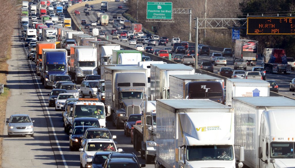Traffic snarls on I-285 westbound due to a midday accident. Photo by Kent D. Johnson / AJC