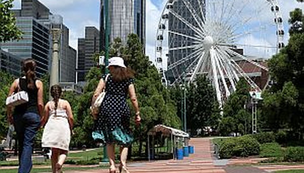 Attractions like the new SkyView Ferris wheel in downtown Atlanta are helping the city reach record tourism levels. SkyView opened to the public July 16, 2013.(AJC photo/Jason Getz)