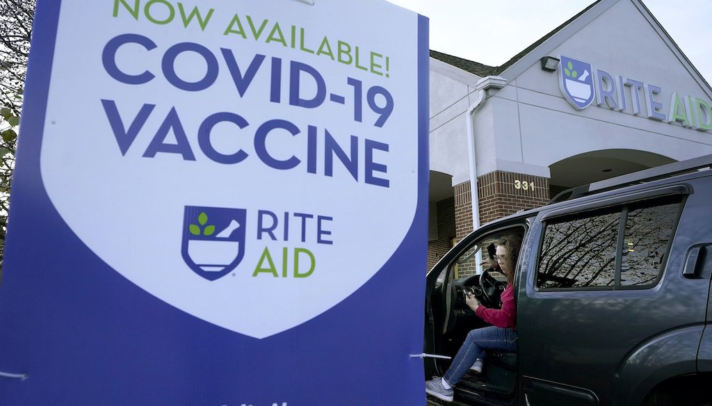 A Rite Aid in New Hampshire promotes the availability of COVID-19 vaccines, Dec. 7, 2021 (AP)